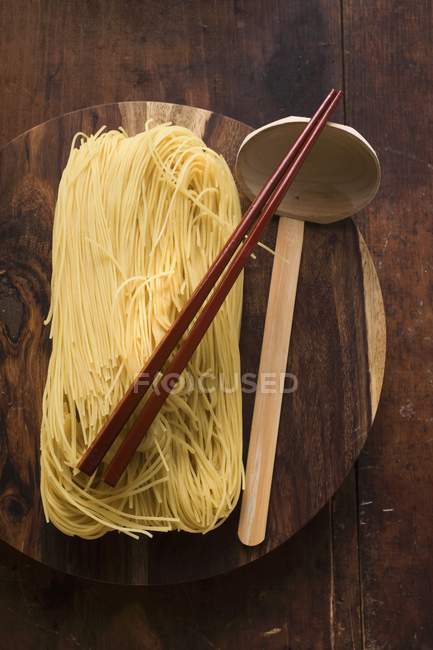 Egg noodles on wooden — Stock Photo