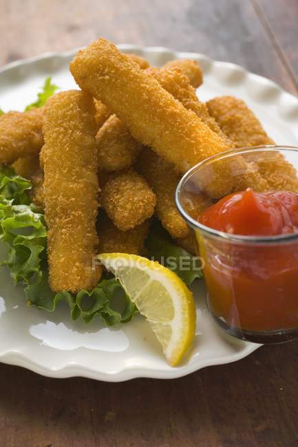 Fish finger with ketchup — Stock Photo