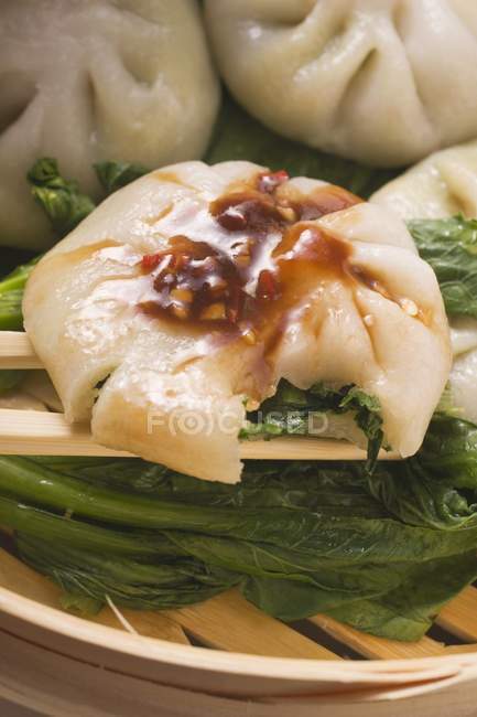 Yeast dumplings  on pak choi — Stock Photo