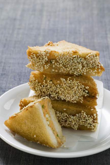 Closeup view of piled sesame toasts with shrimp filling — Stock Photo