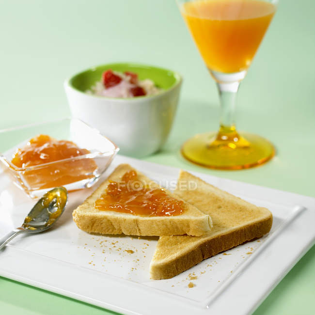Toasts and orange juice — Stock Photo