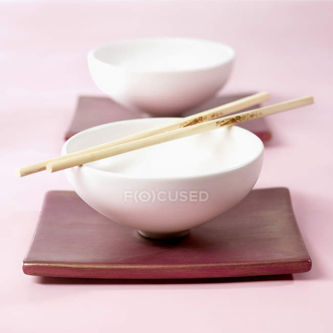 Food bowls with shopsticks — Stock Photo