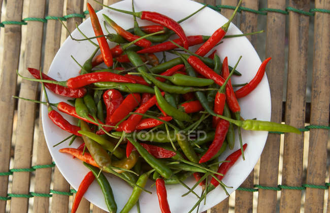 Thai chili peppers in white plate — Stock Photo