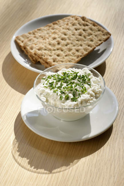 Cottage cheese in glass bow — Stock Photo
