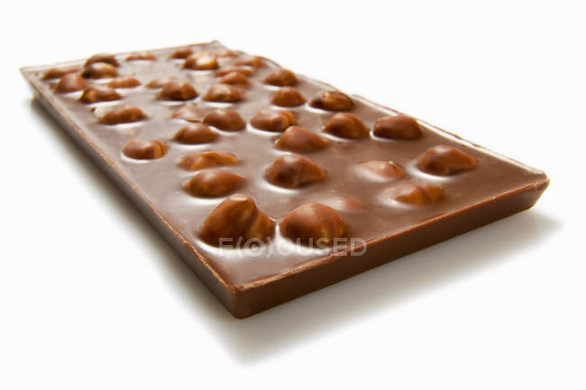 Bar of nut chocolate — Stock Photo