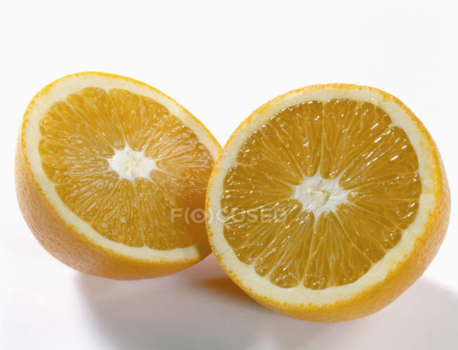 Fresh orange halves — Stock Photo