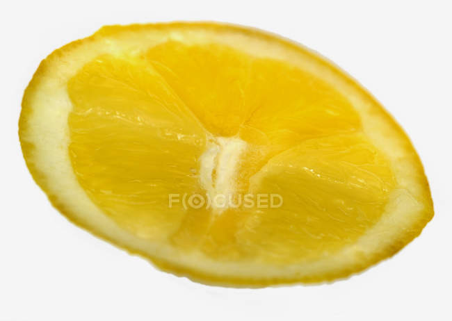 Fresh lemon wedge — Stock Photo