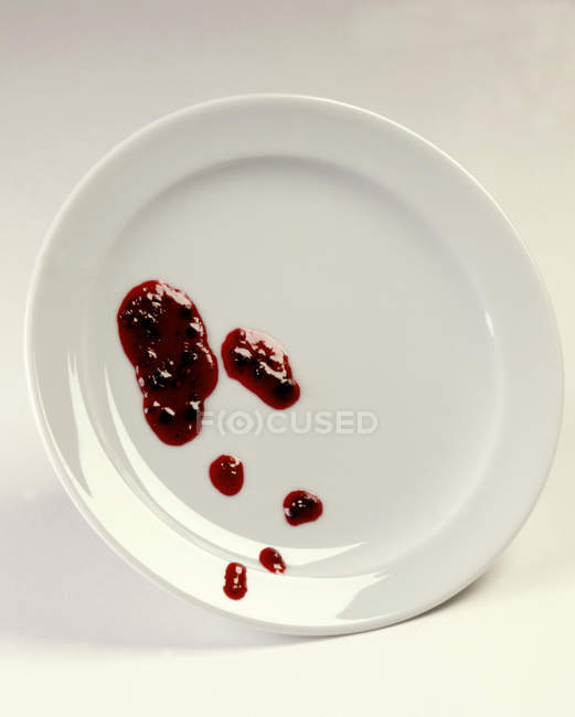 Blobs of jam on plate — Stock Photo
