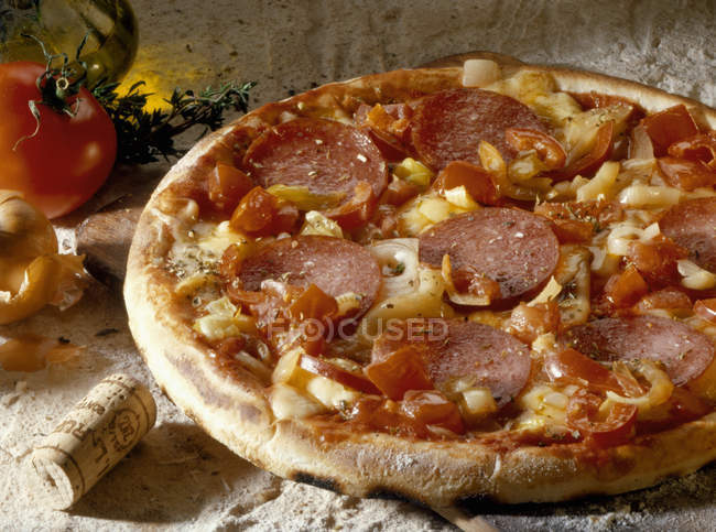Pizza with salami and vegetables — Stock Photo