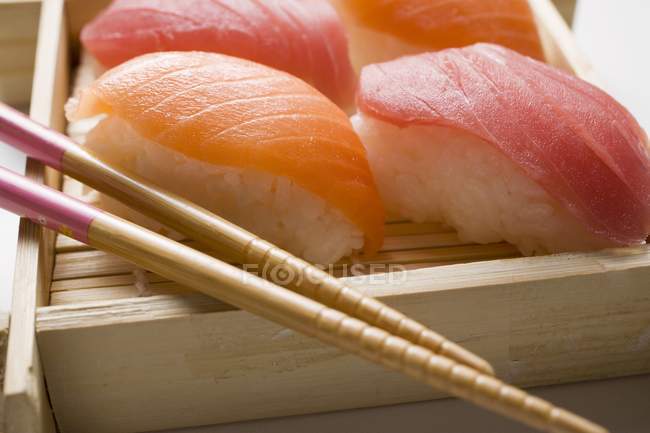 Nigiri sushi with chopsticks — Stock Photo