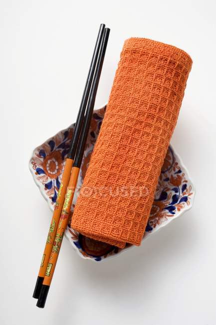 Chopsticks and hand towel — Stock Photo