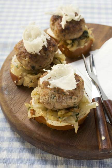 Burgers with onions and horseradish — Stock Photo