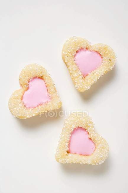 Печиво у формі серця з рожевим глазур'ю — стокове фото