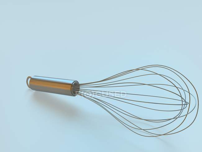 Closeup view of a one balloon whisk on blue surface — Stock Photo
