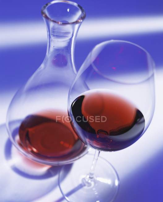 Red wine in glass and carafe — Stock Photo