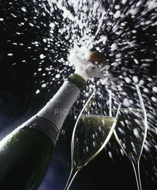 Cork flying out of sparkling wine — Stock Photo