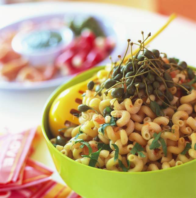 Pasta with capers and basil — Stock Photo