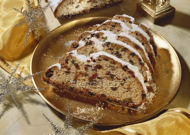 Butter stollen with almonds and candied fruits — Stock Photo