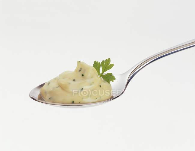 Closeup view of herbal mayonnaise on spoon — Stock Photo