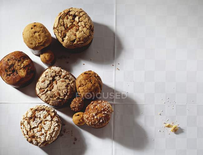 Top view of mini Panettones on white surface — Stock Photo