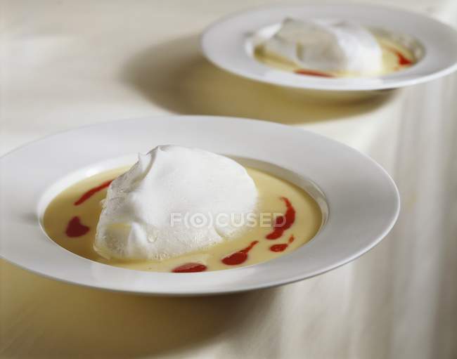 Poached meringue in custard — Stock Photo