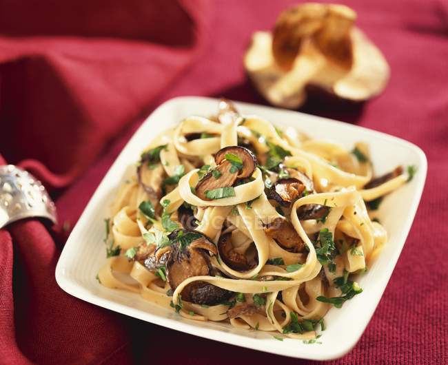 Ribbon pasta with mushrooms — Stock Photo