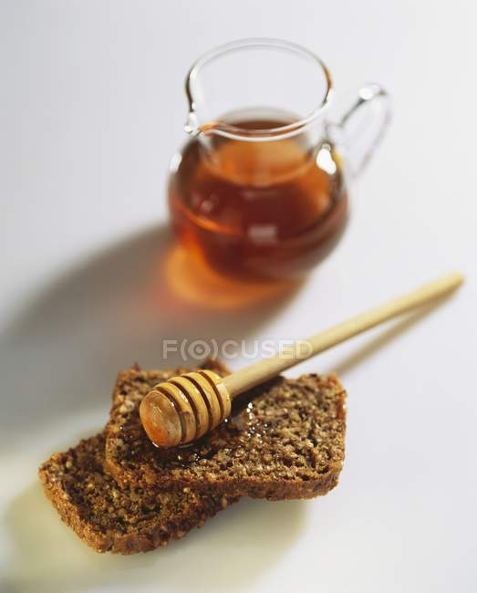 Wholegrain bread with honey — Stock Photo