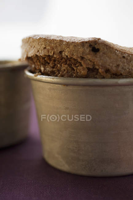 Closeup view of chocolate souffle in baking dish — Stock Photo