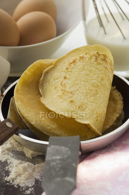 Pancakes in frying pan — Stock Photo