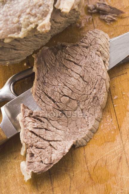 Boiled beef with a slice — Stock Photo