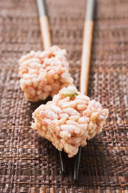 Rice sweets on spoon — Stock Photo