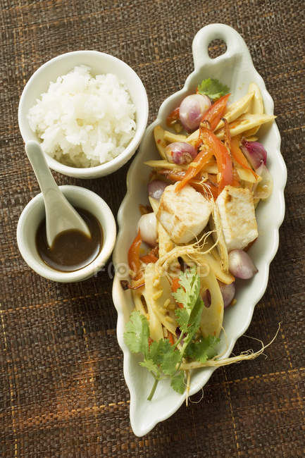Fish fillet with bamboo and rice — Stock Photo