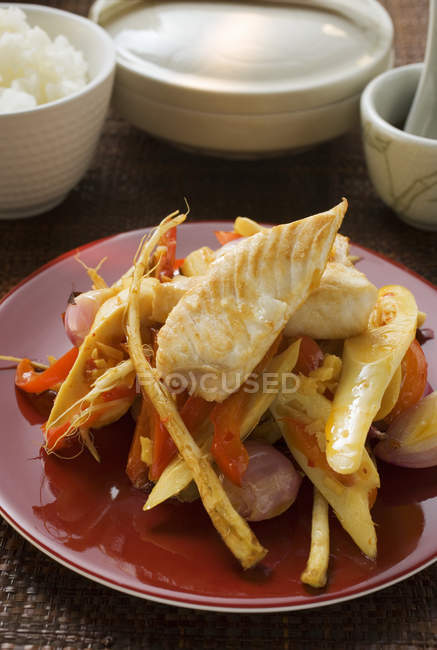 Fish fillets on bamboo shoots — Stock Photo