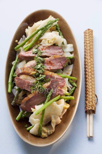 Duck breast with rice noodles — Stock Photo