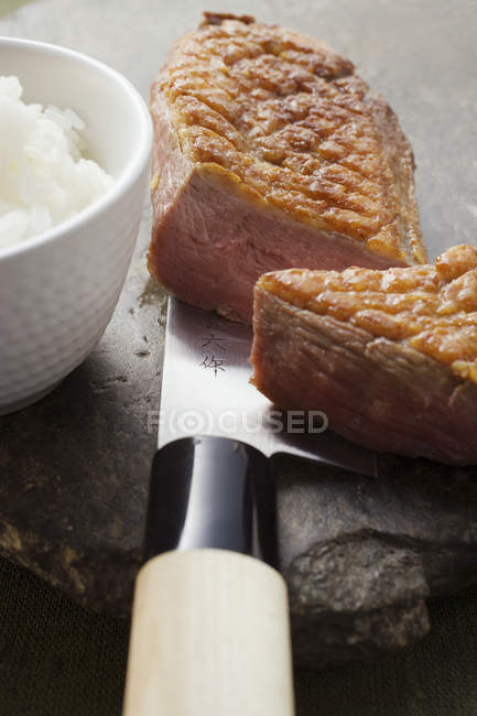 Duck breast and bowl of rice — Stock Photo