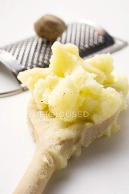 Mashed potato on wooden spoon — Stock Photo