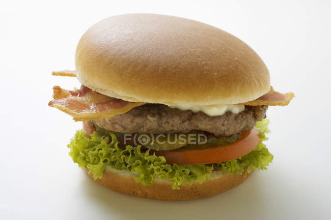 Hamburger with bacon and mayonnaise — Stock Photo