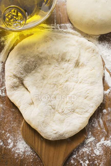 Closeup top view of raw dough with oil — Stock Photo