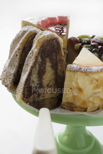 Pieces of cake on cake stand — Stock Photo