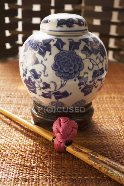 Asian jar and chopsticks — Stock Photo
