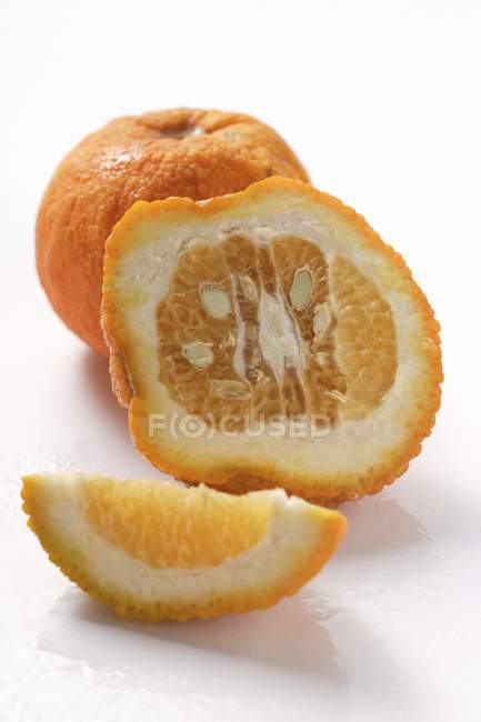 Whole and sliced Ugli fruit — Stock Photo