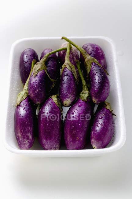Baby aubergines with drops — Stock Photo