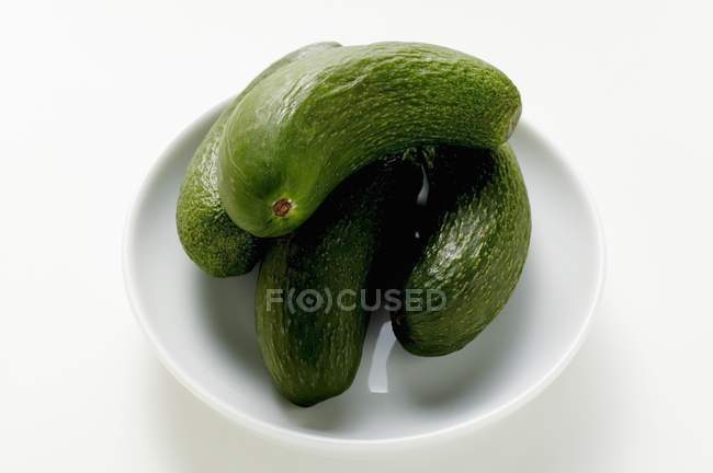 Green Baby courgettes in bowl — Stock Photo