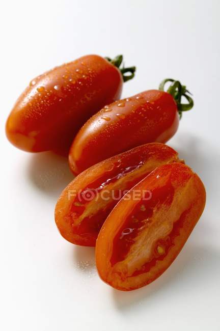 Three grape tomatoes — Stock Photo