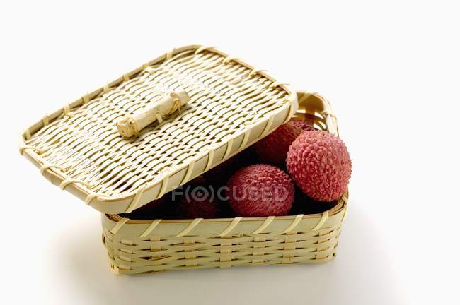 Fresh Lychees in basket — Stock Photo