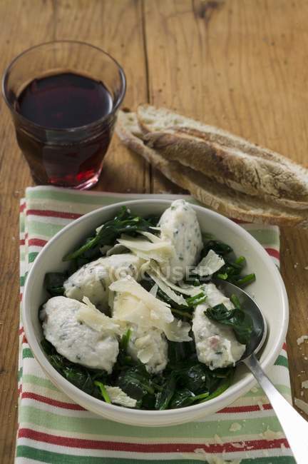 Ricotta and Mortadella Gnocchi with spinach and Parmesan — Stock Photo