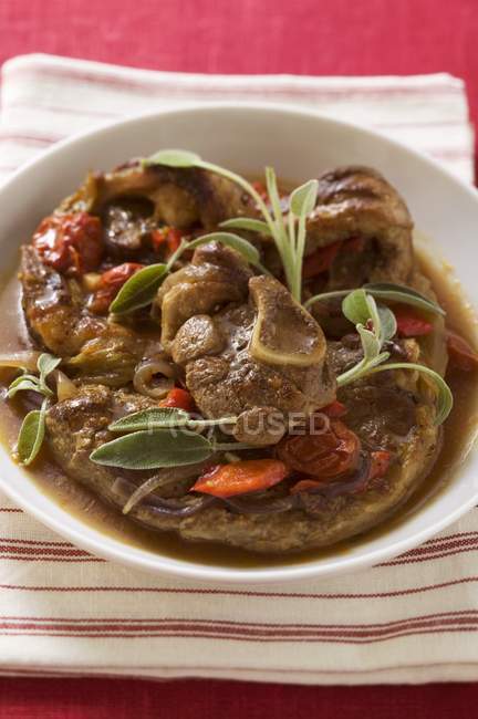 Osso buco with tomatoes — Stock Photo