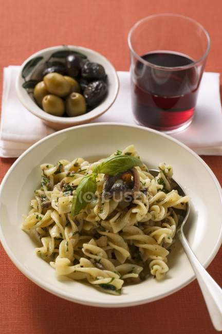 Fusilli pasta with sardines and basil — Stock Photo