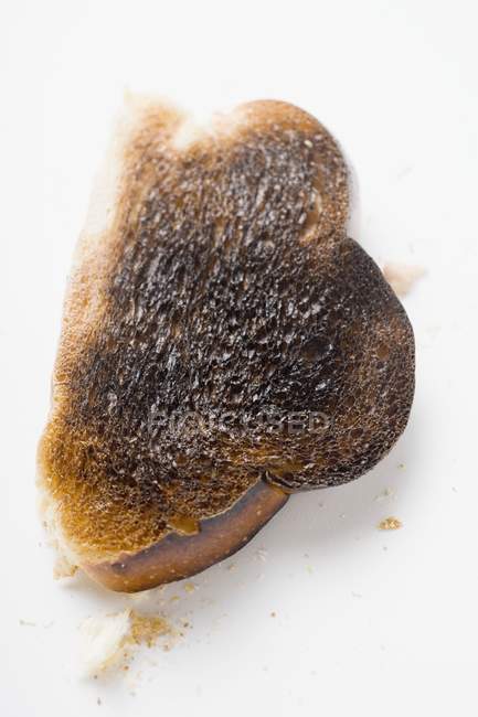 Шматочок спаленого тосту — стокове фото