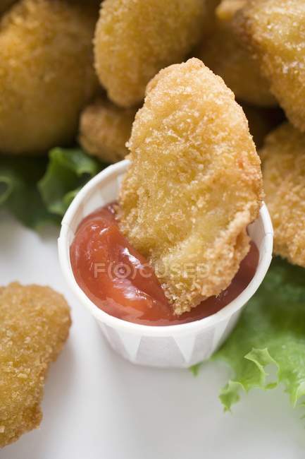 Chicken Nugget in ketchup — Stock Photo
